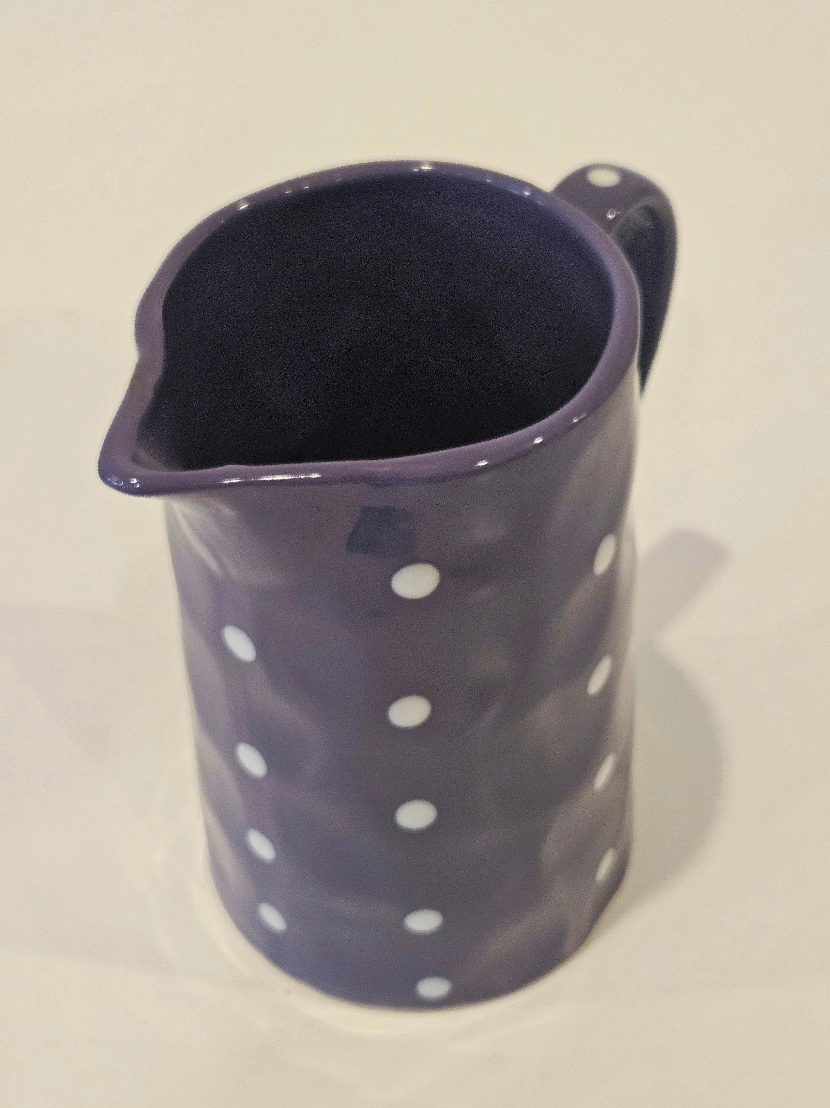 Purple polkadot pitcher vase arrangement