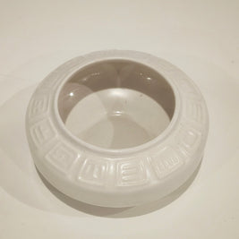 Round ikebana pottery vase arrangement