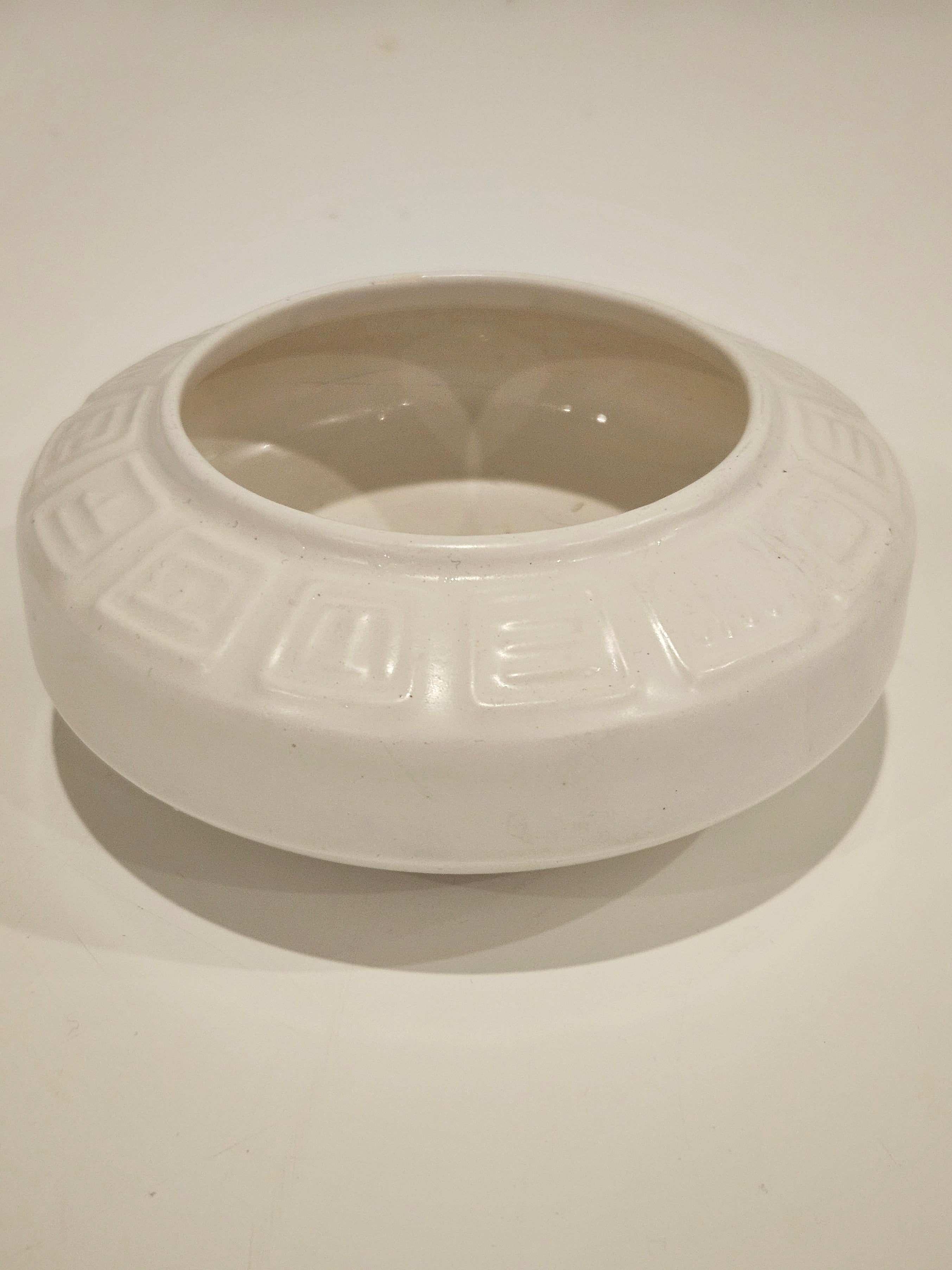 Round ikebana pottery vase arrangement