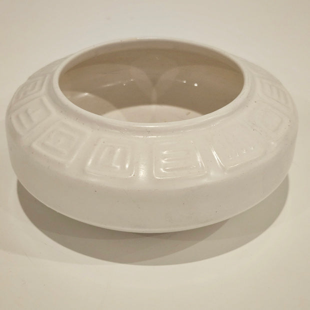 Round ikebana pottery vase arrangement