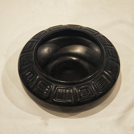 Round ikebana pottery vase arrangement