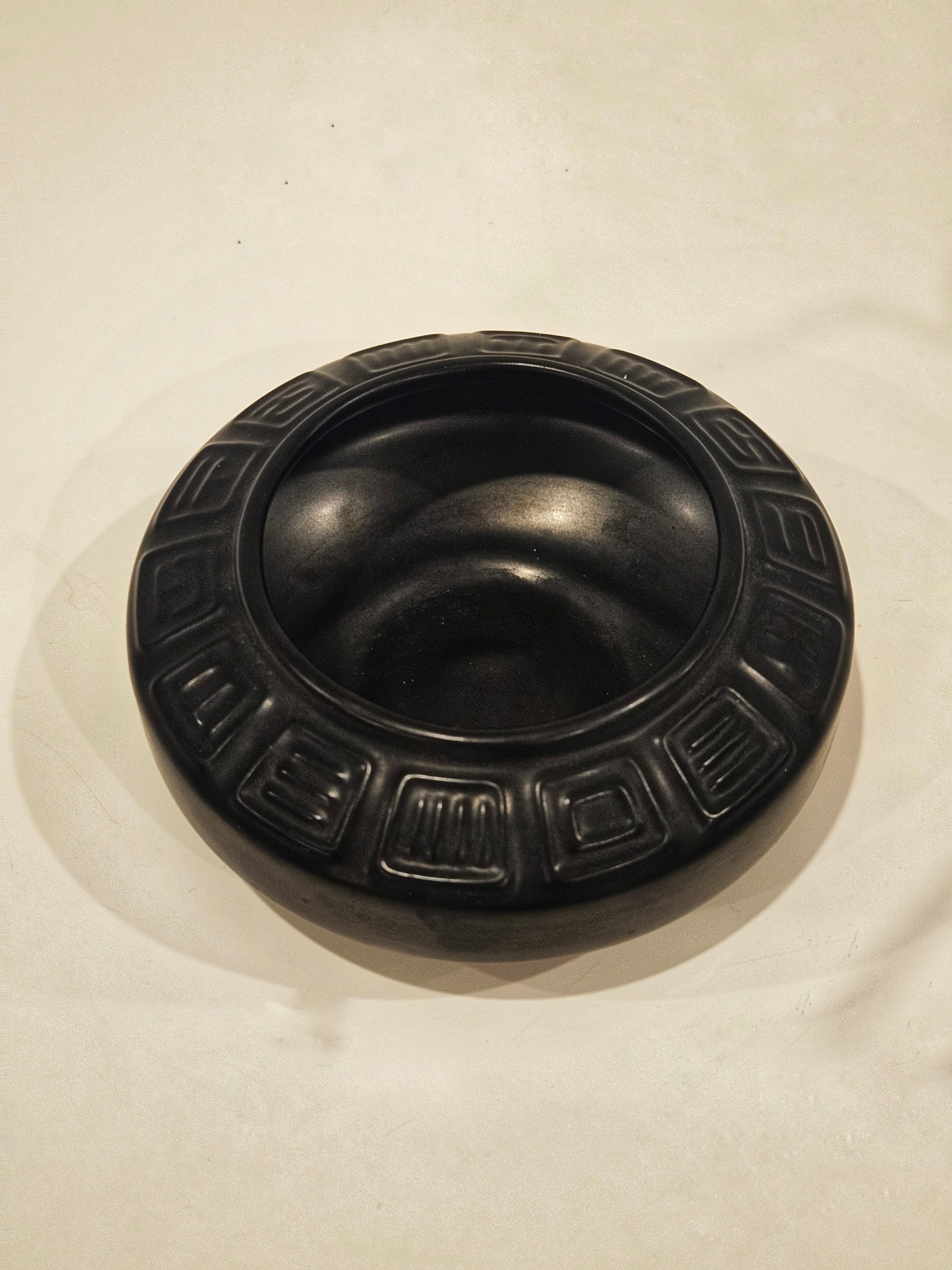 Round ikebana pottery vase arrangement