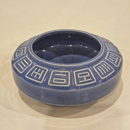 Round ikebana pottery vase arrangement