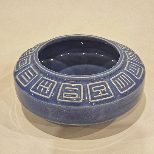 Round ikebana pottery vase arrangement