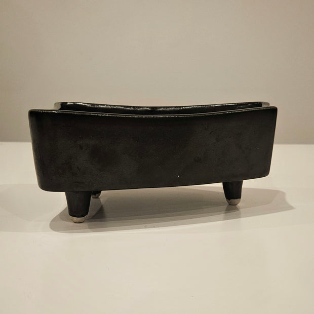 Black ikebana-inspired vase arrangement