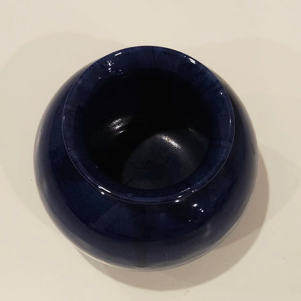 Round dark blue vase arrangement