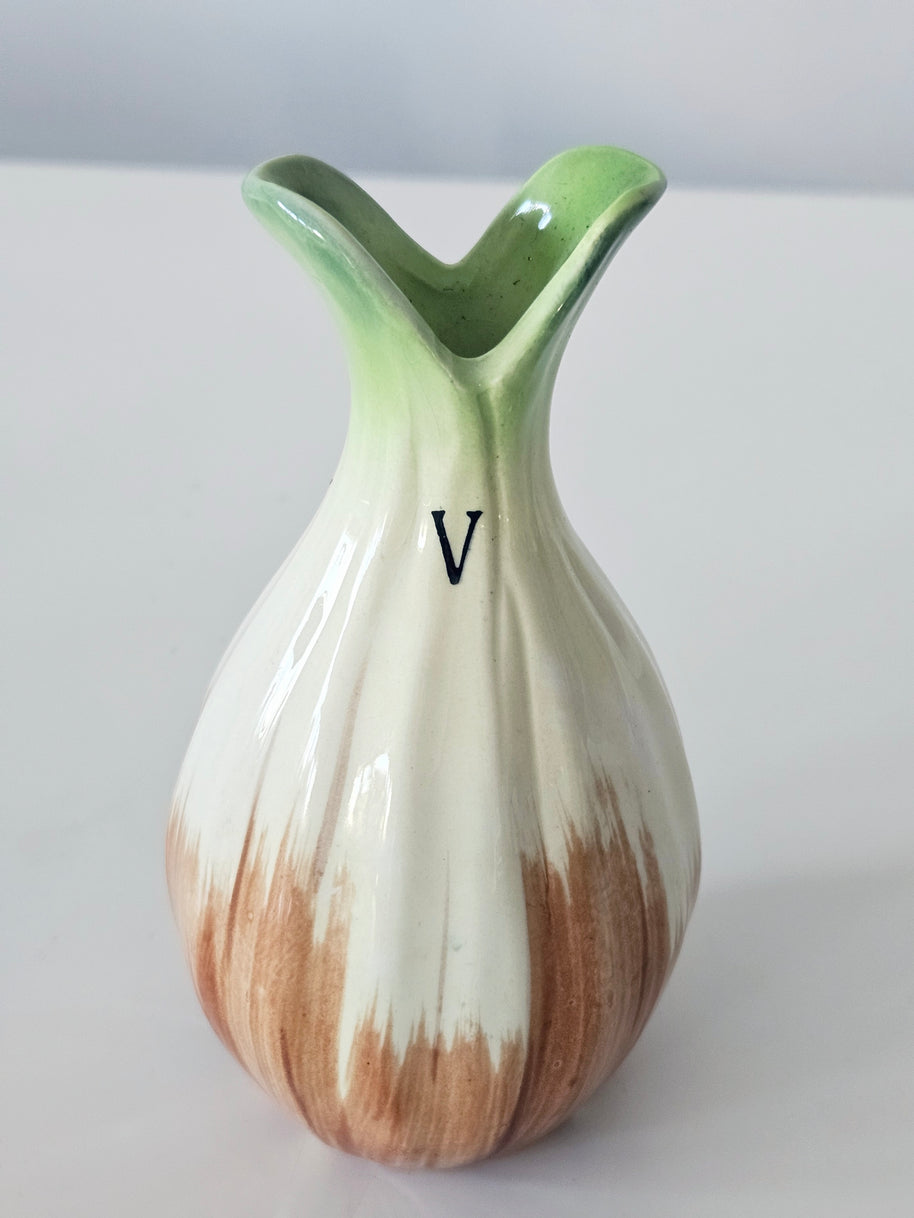 Green and orange bud vase arrangement
