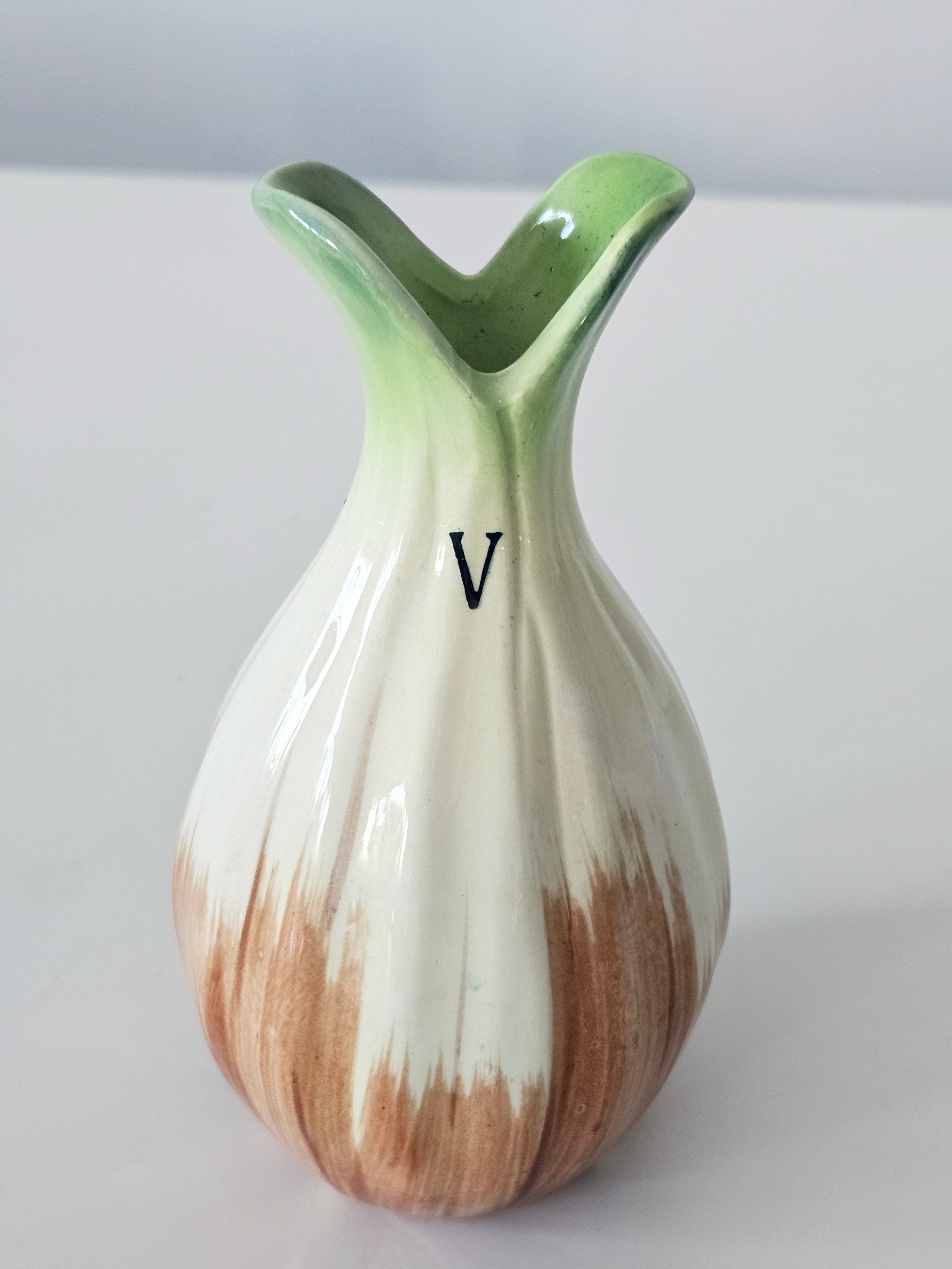 Green and orange bud vase arrangement