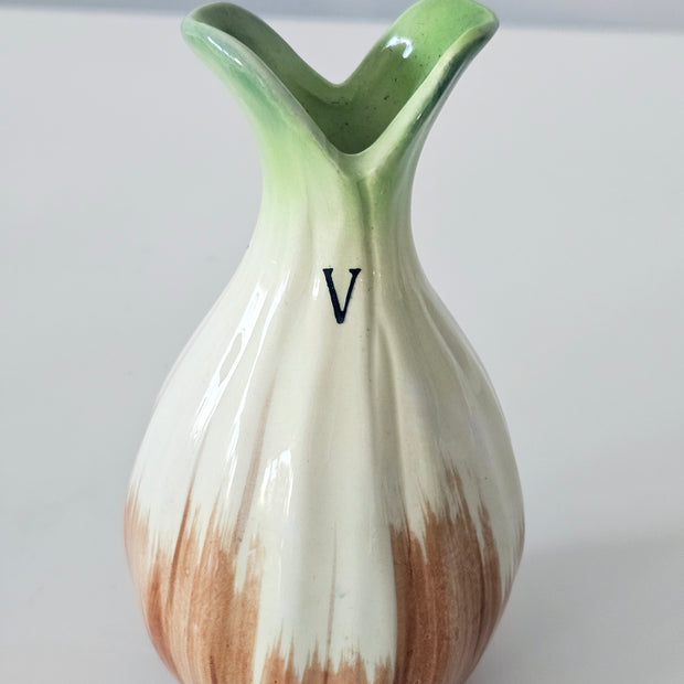 Green and orange bud vase arrangement