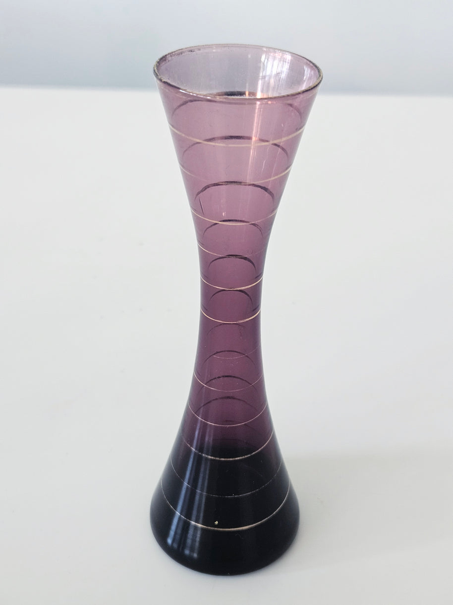 Purple and gold striped bud vase arrangement