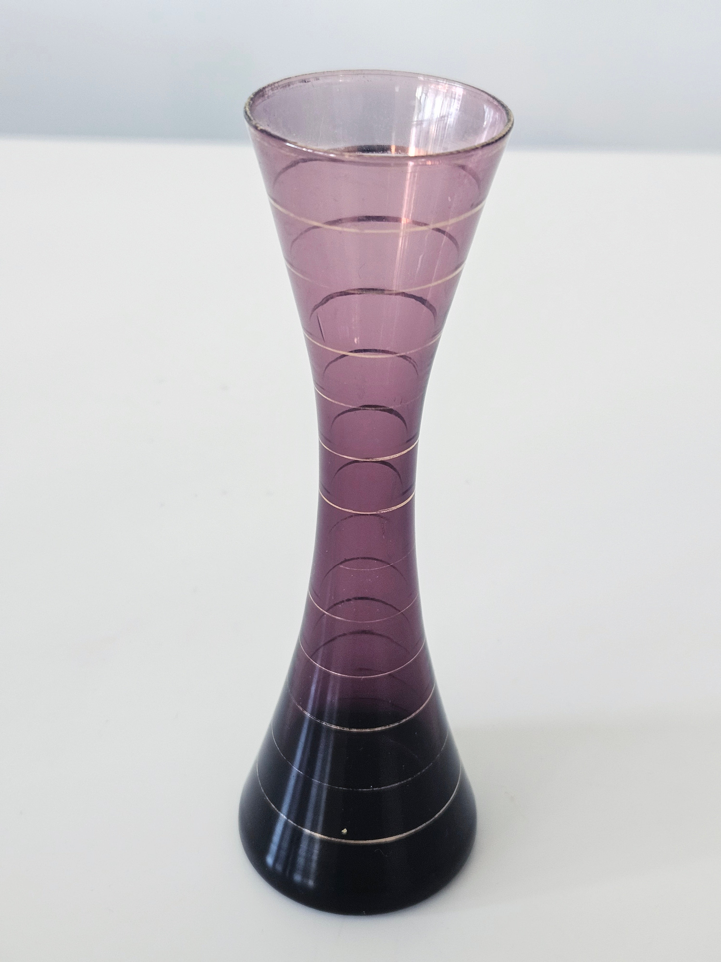 Purple and gold striped bud vase arrangement