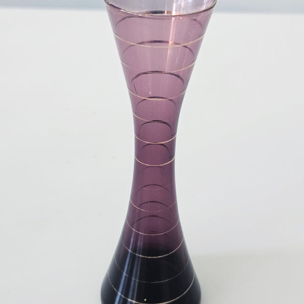 Purple and gold striped bud vase arrangement