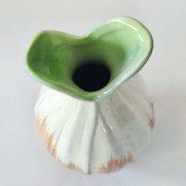 Green and orange bud vase arrangement