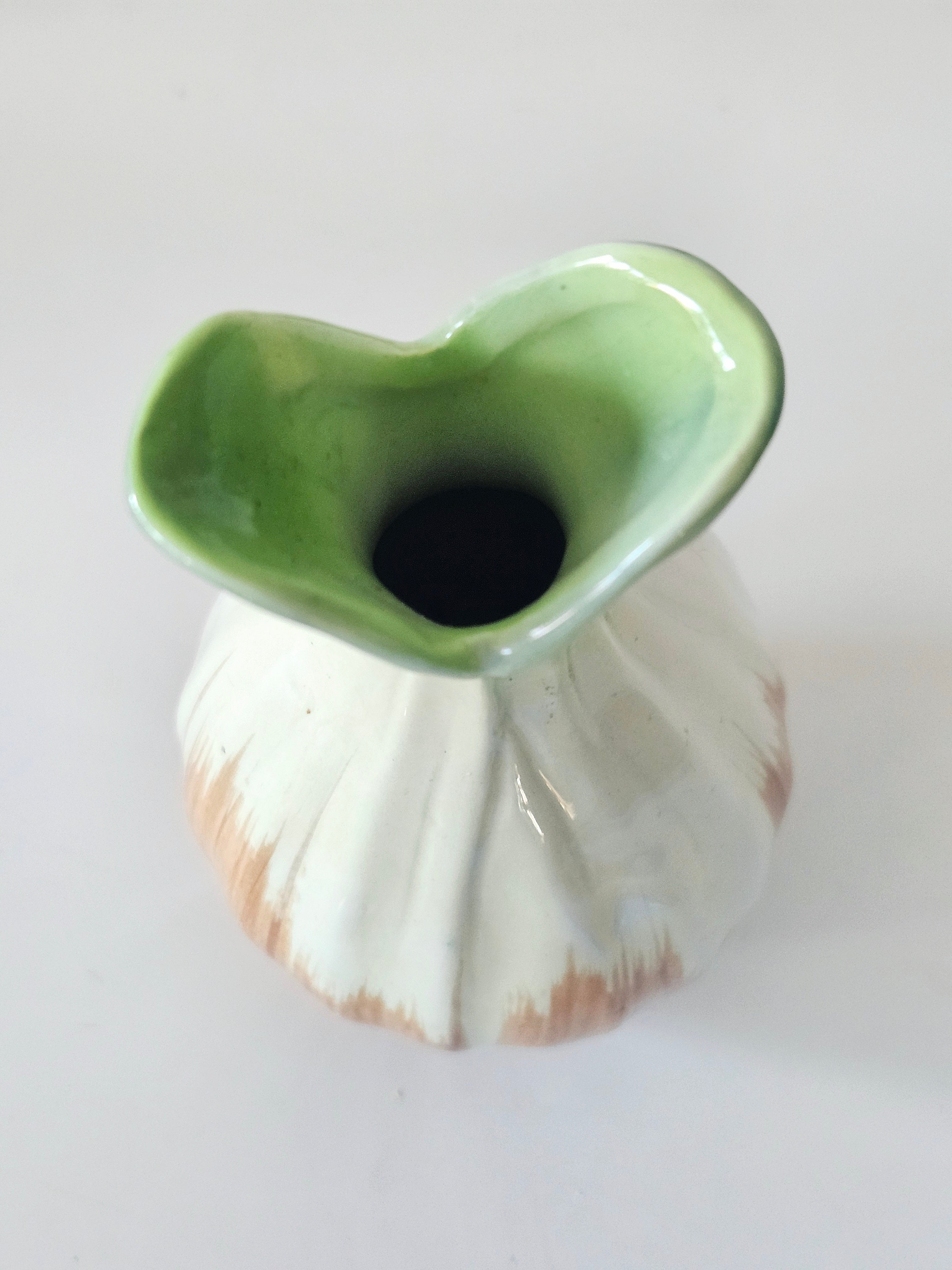 Green and orange bud vase arrangement