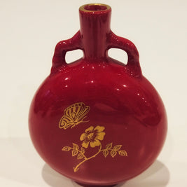 Red and gold bud vase arrangement