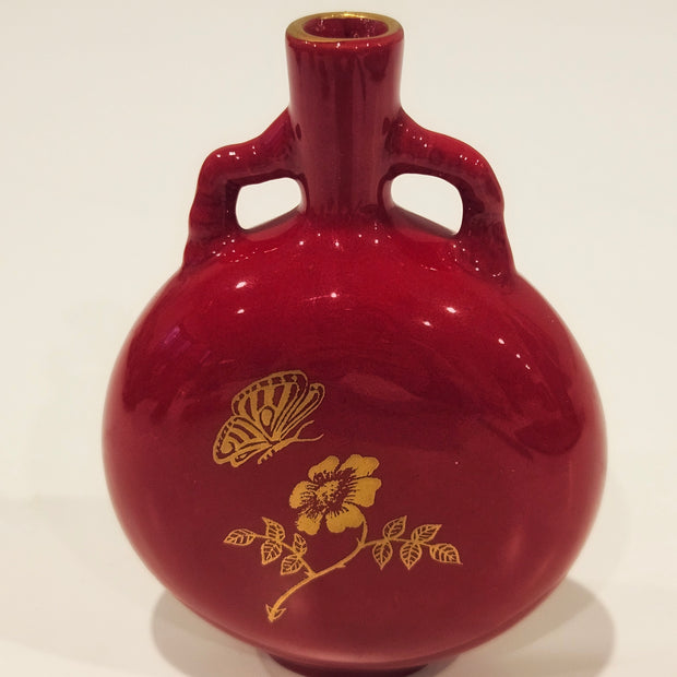 Red and gold bud vase arrangement