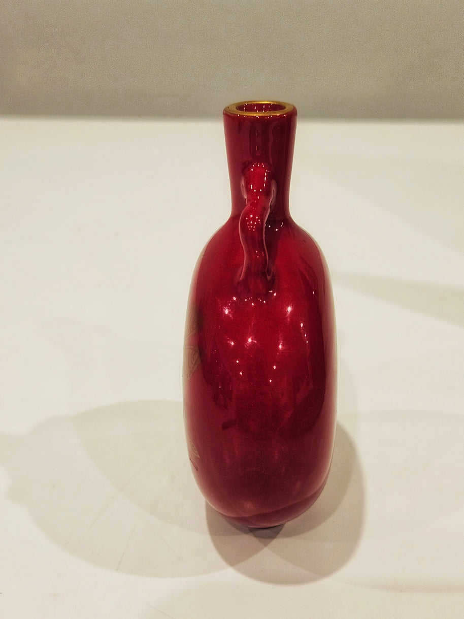 Red and gold bud vase arrangement