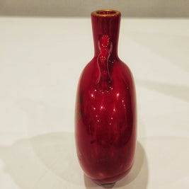 Red and gold bud vase arrangement