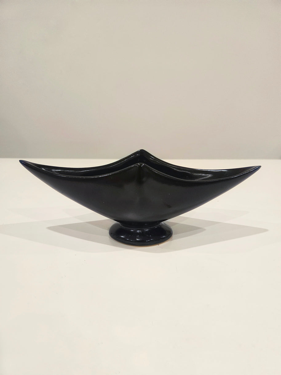 Sleek black ikebana vase arrangement with kenzan