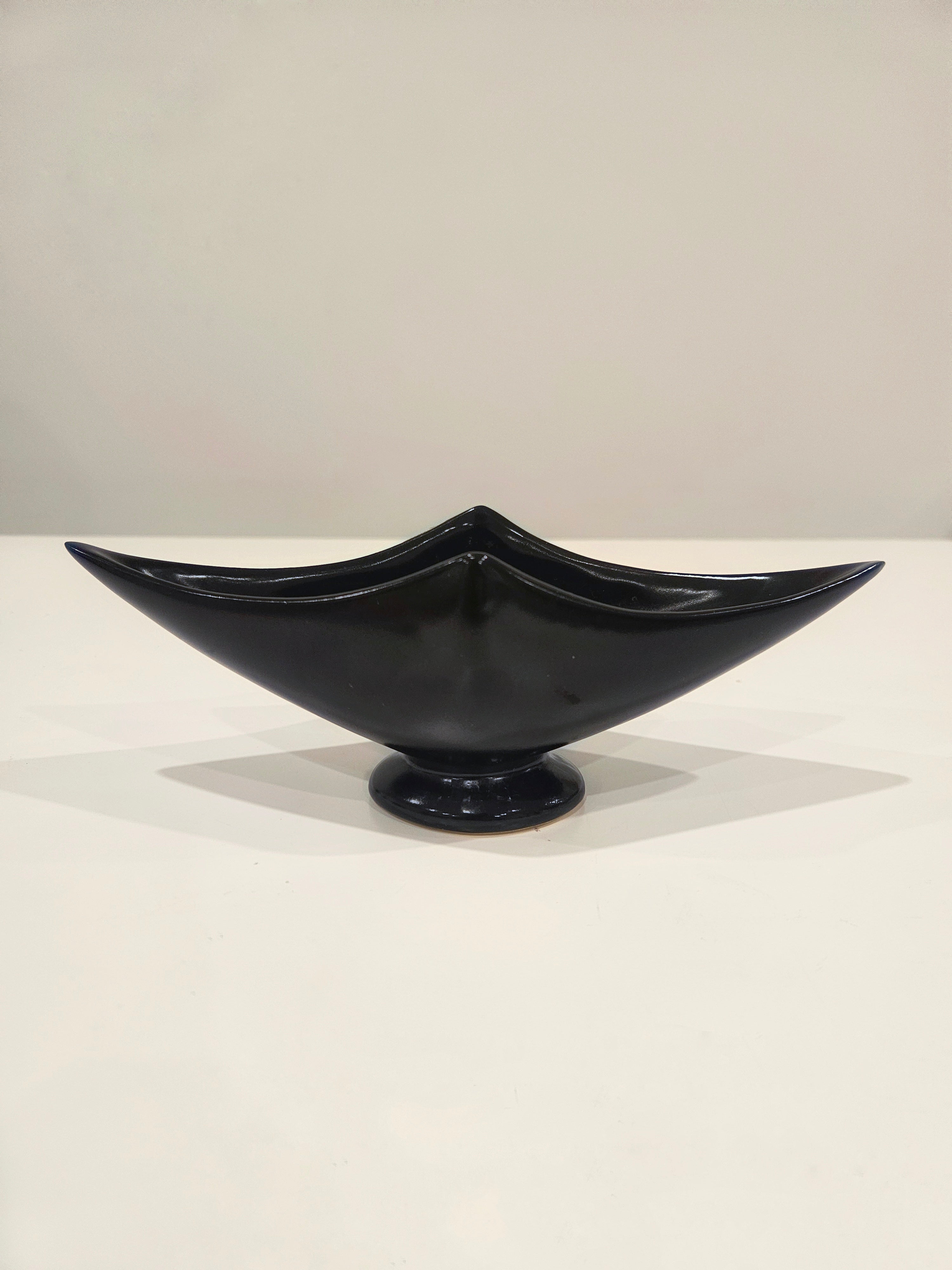 Sleek black ikebana vase arrangement with kenzan