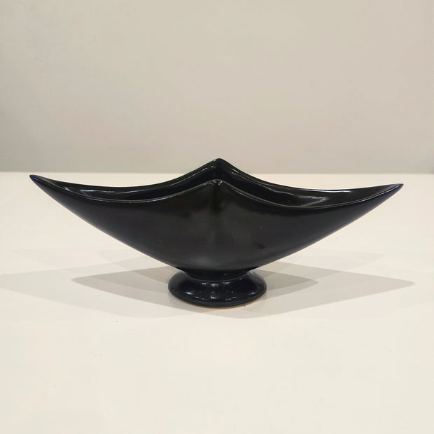 Sleek black ikebana vase arrangement with kenzan