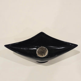 Sleek black ikebana vase arrangement with kenzan