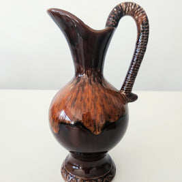 Glossy brown pitcher arrangement