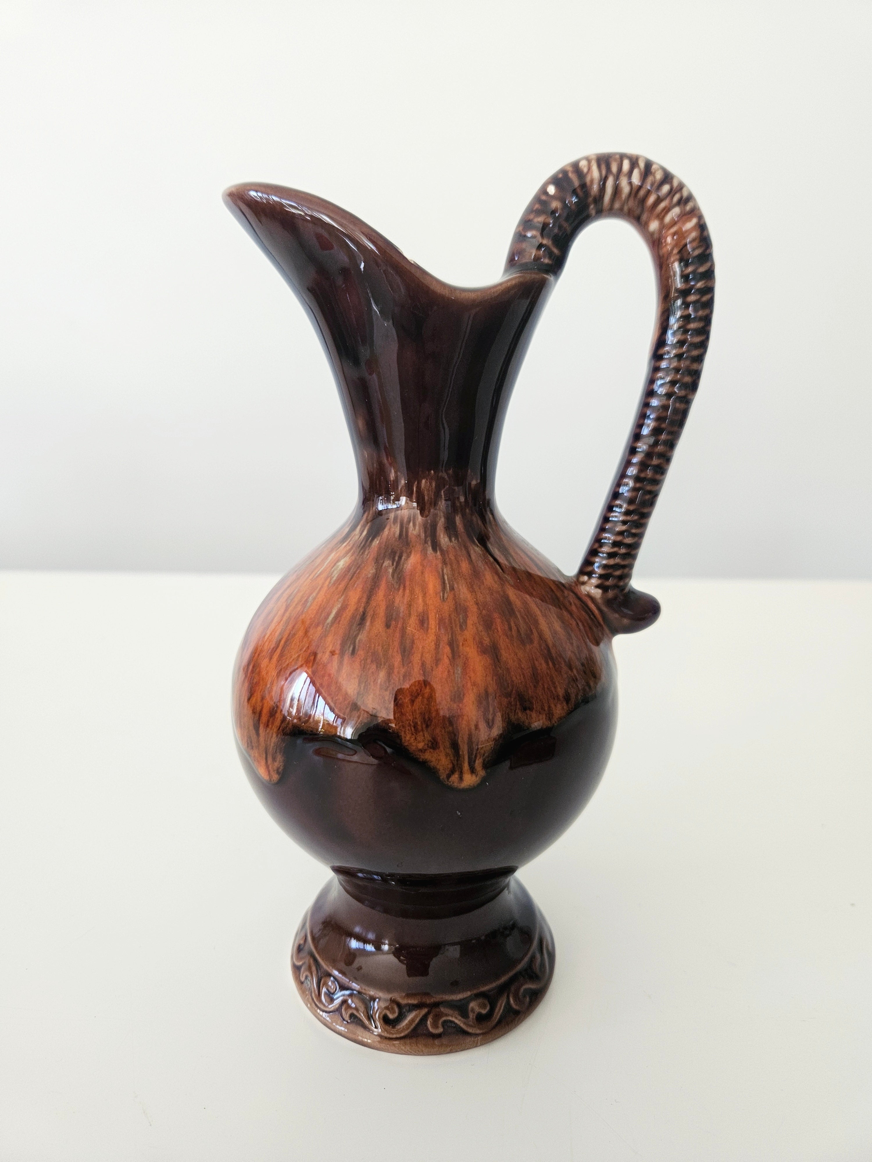 Glossy brown pitcher arrangement