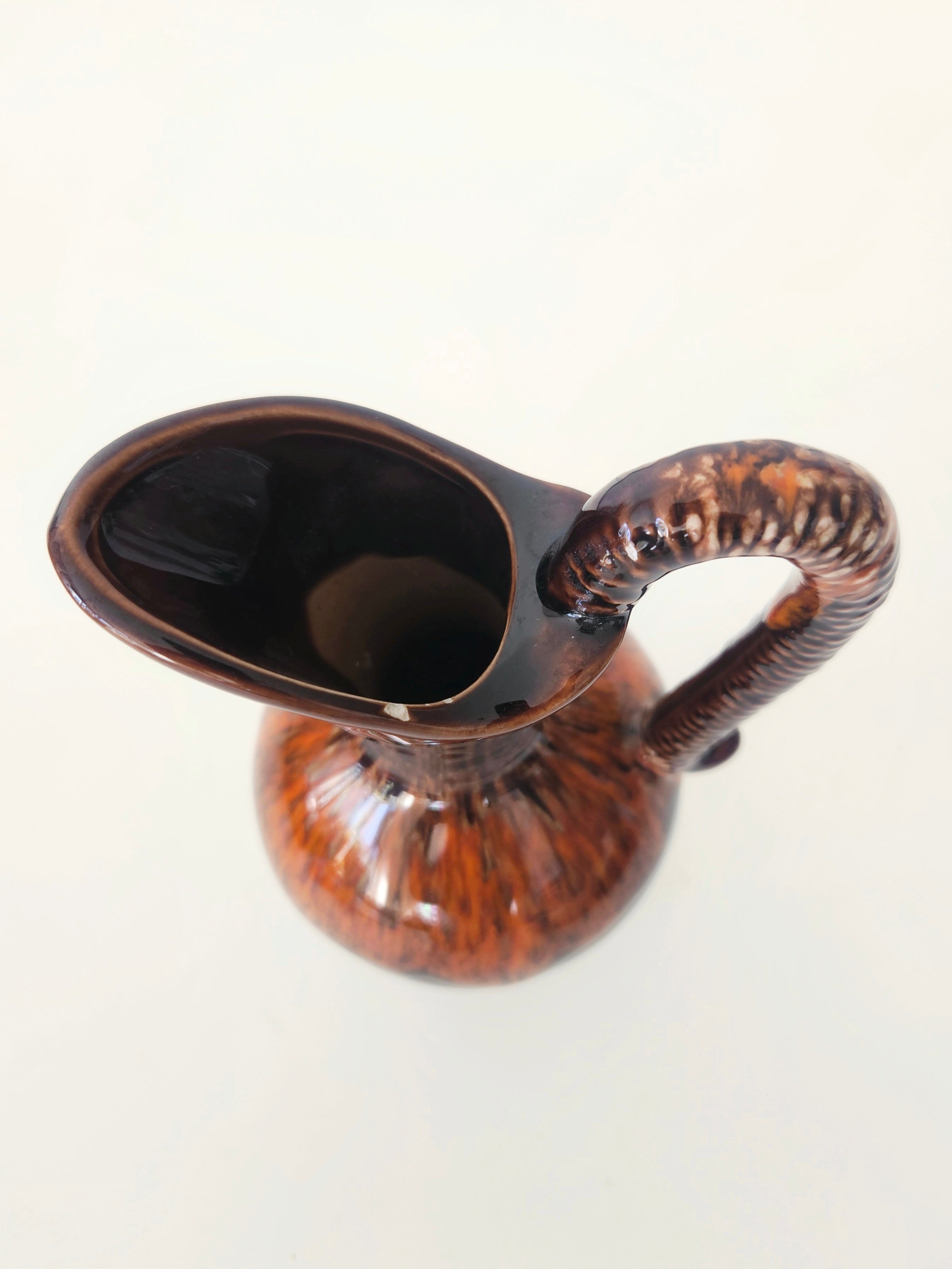 Glossy brown pitcher arrangement