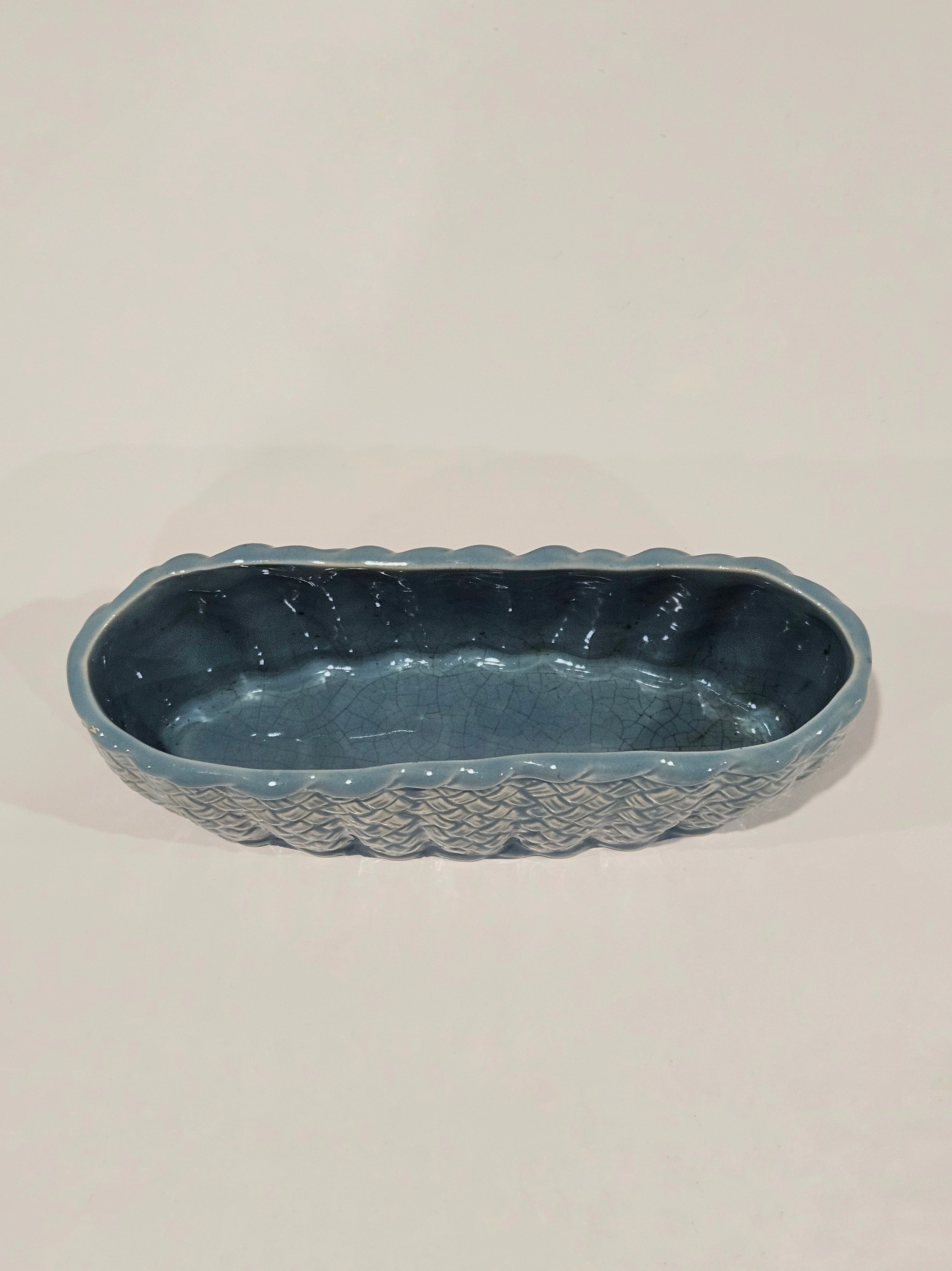 Top down view of a blue ceramic table vase