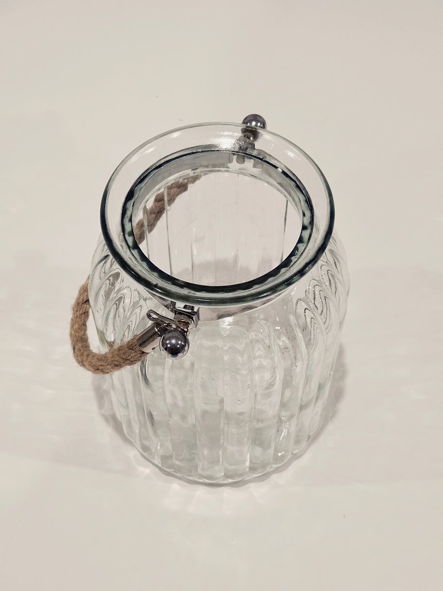 Top down view of a large glass jar with a rope handle