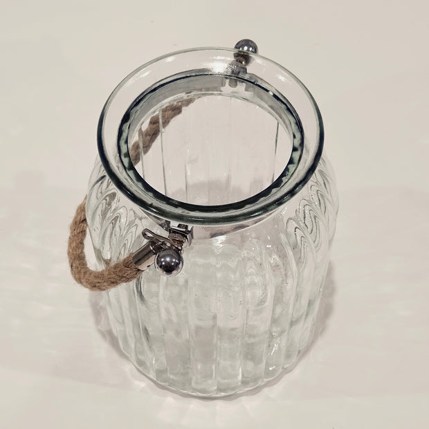 Top down view of a large glass jar with a rope handle