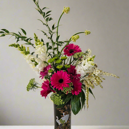 Bouquet of flowers in a black decorative vase with white stalks on a plain background