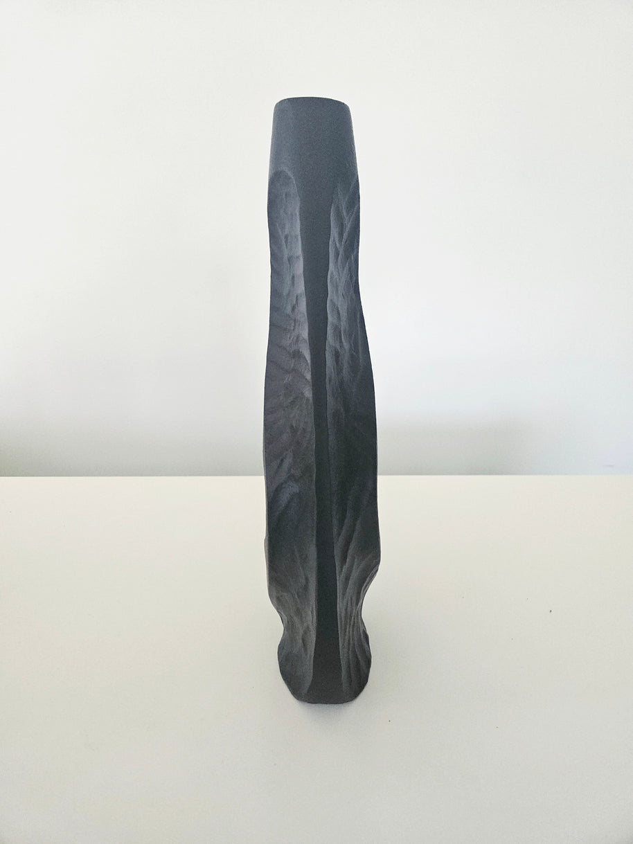 Side view of a black vase