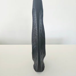 Side view of a black vase