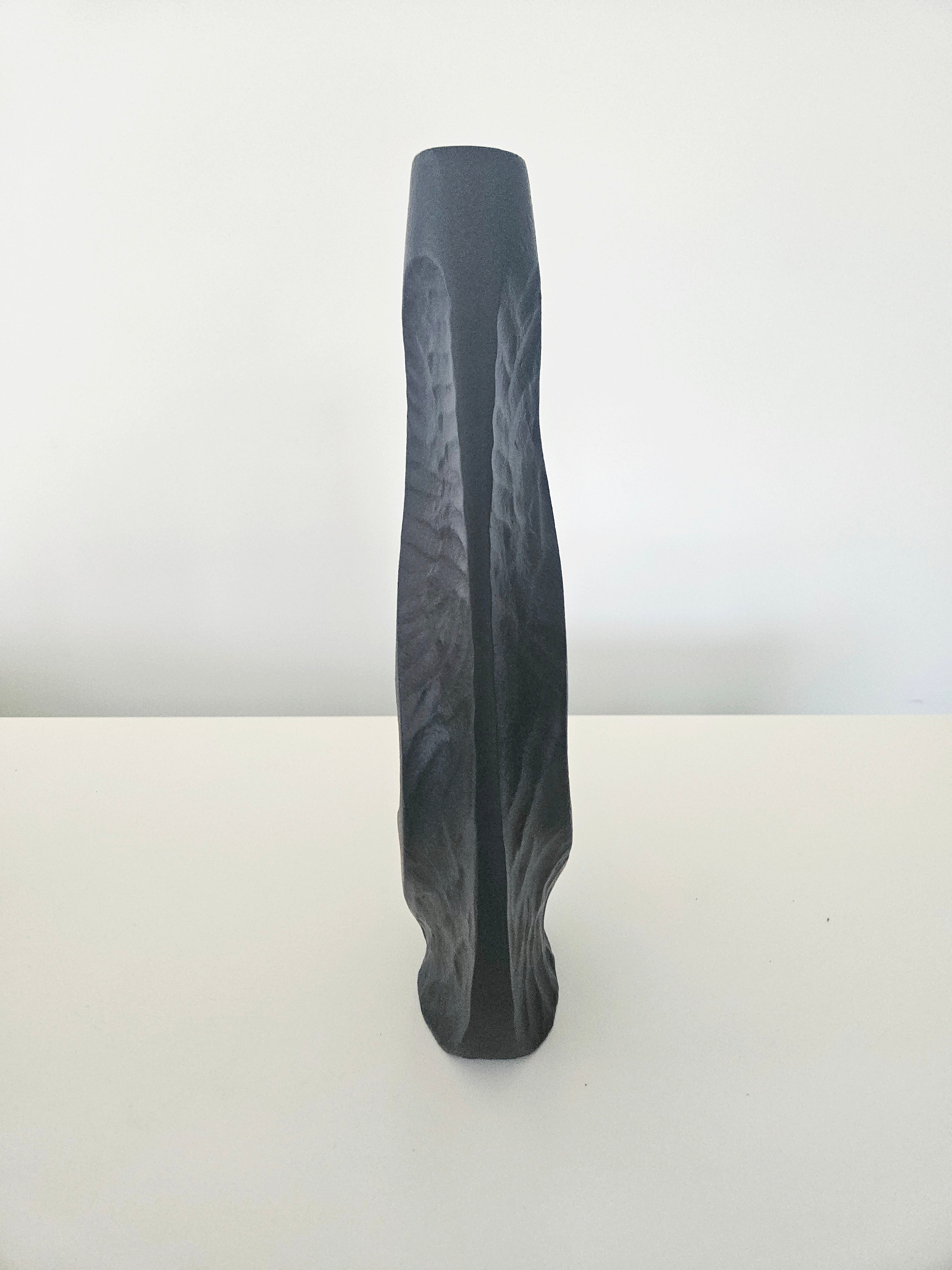 Side view of a black vase