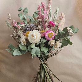 Bouquet of flowers with greenery on a beige background