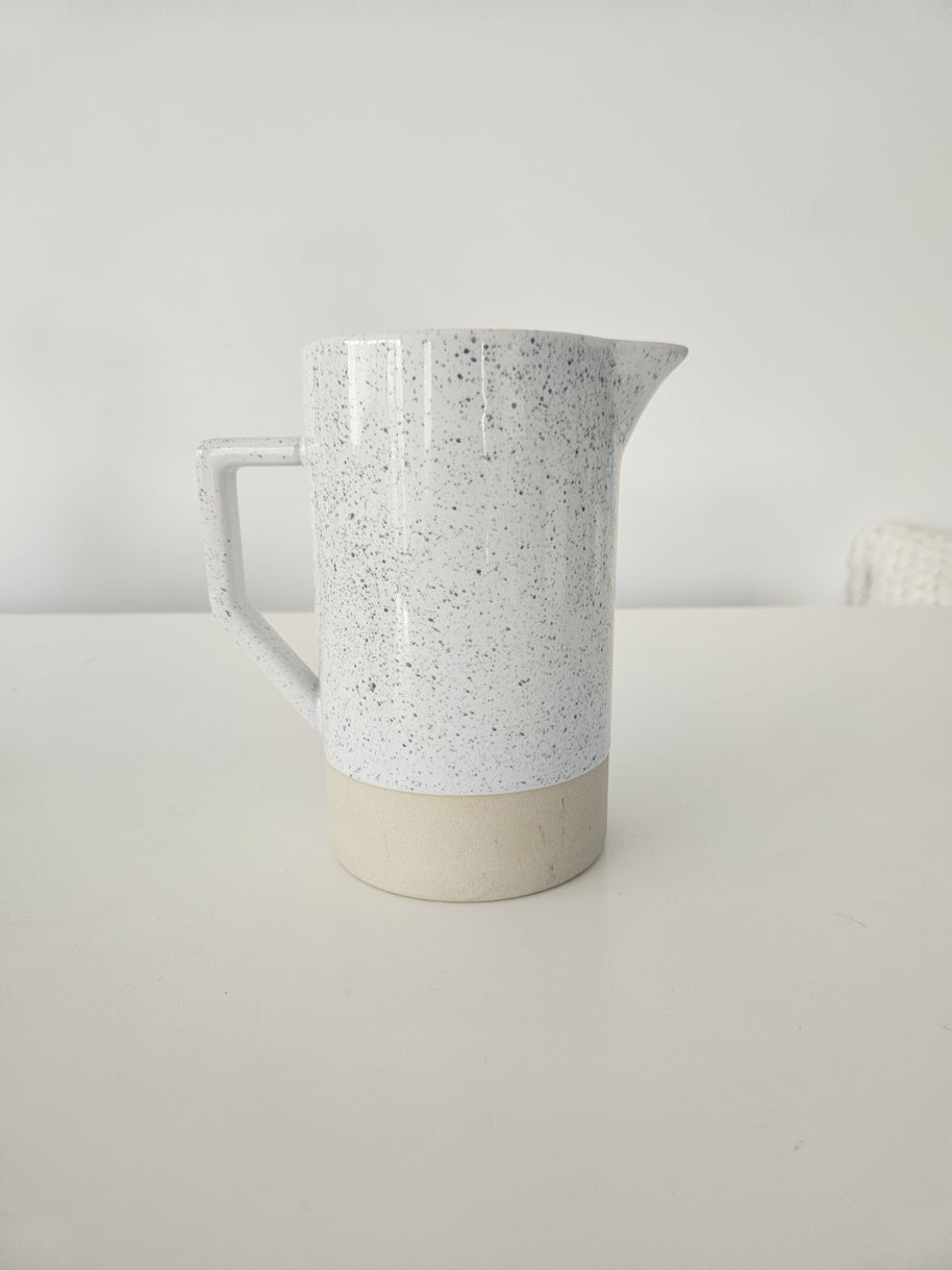 Speckled white and tan pitcher vase arrangement