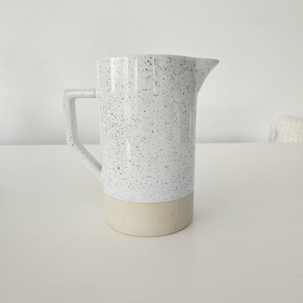 Speckled white and tan pitcher vase arrangement