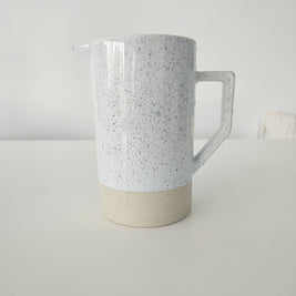 Speckled white and tan pitcher vase arrangement