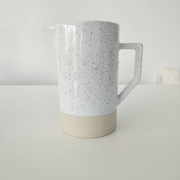 Speckled white and tan pitcher vase arrangement