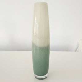 Tall cylindrical vase with two-tone design on a white background
