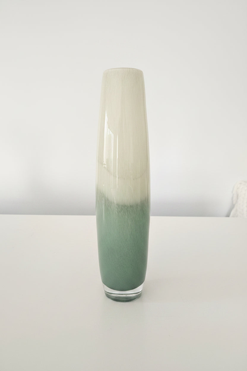 Tall cylindrical vase with two-tone design on a white background