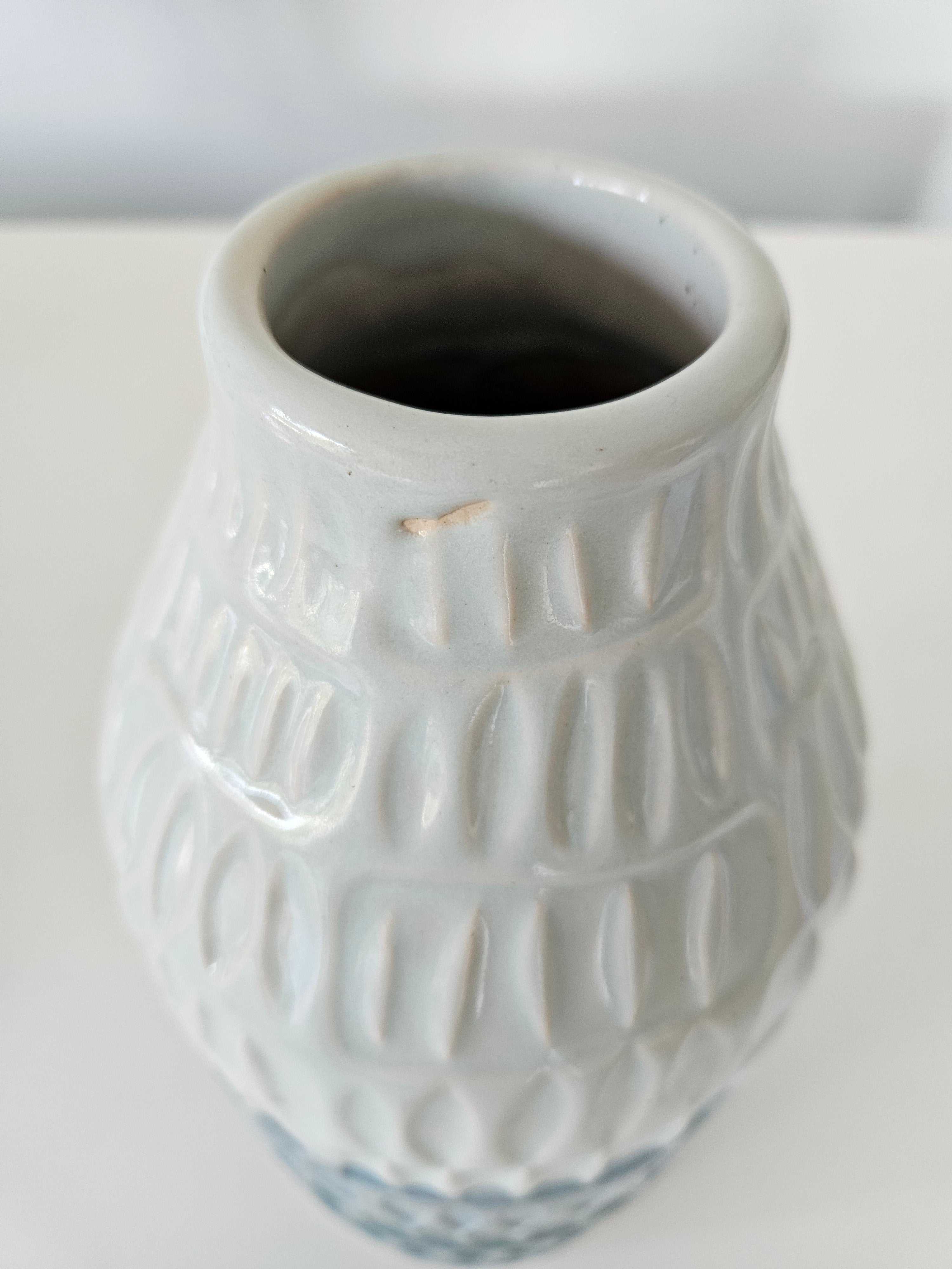 Blue striped ceramic vase arrangement