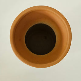 Terracotta pot on a white background
