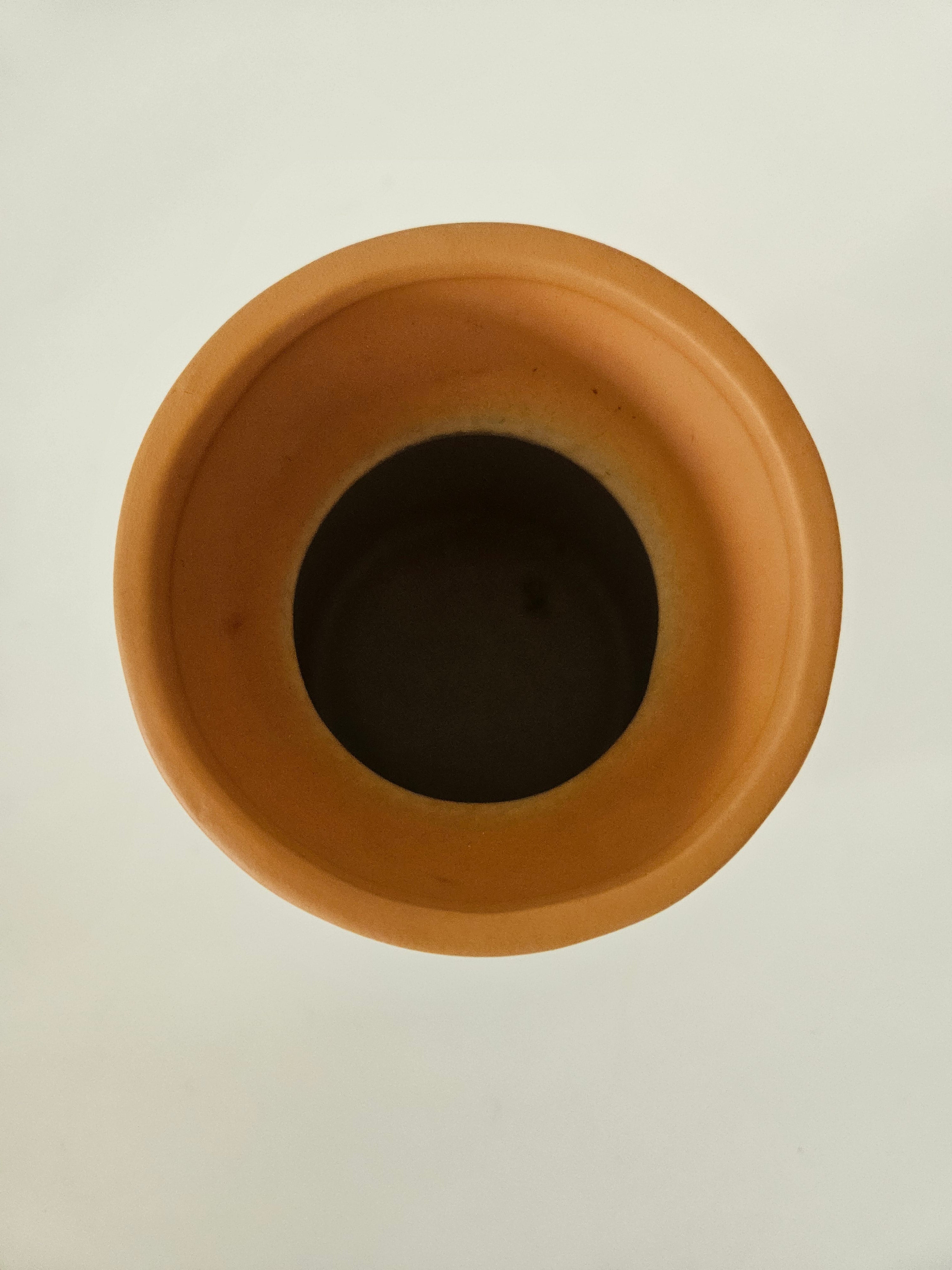 Terracotta pot on a white background