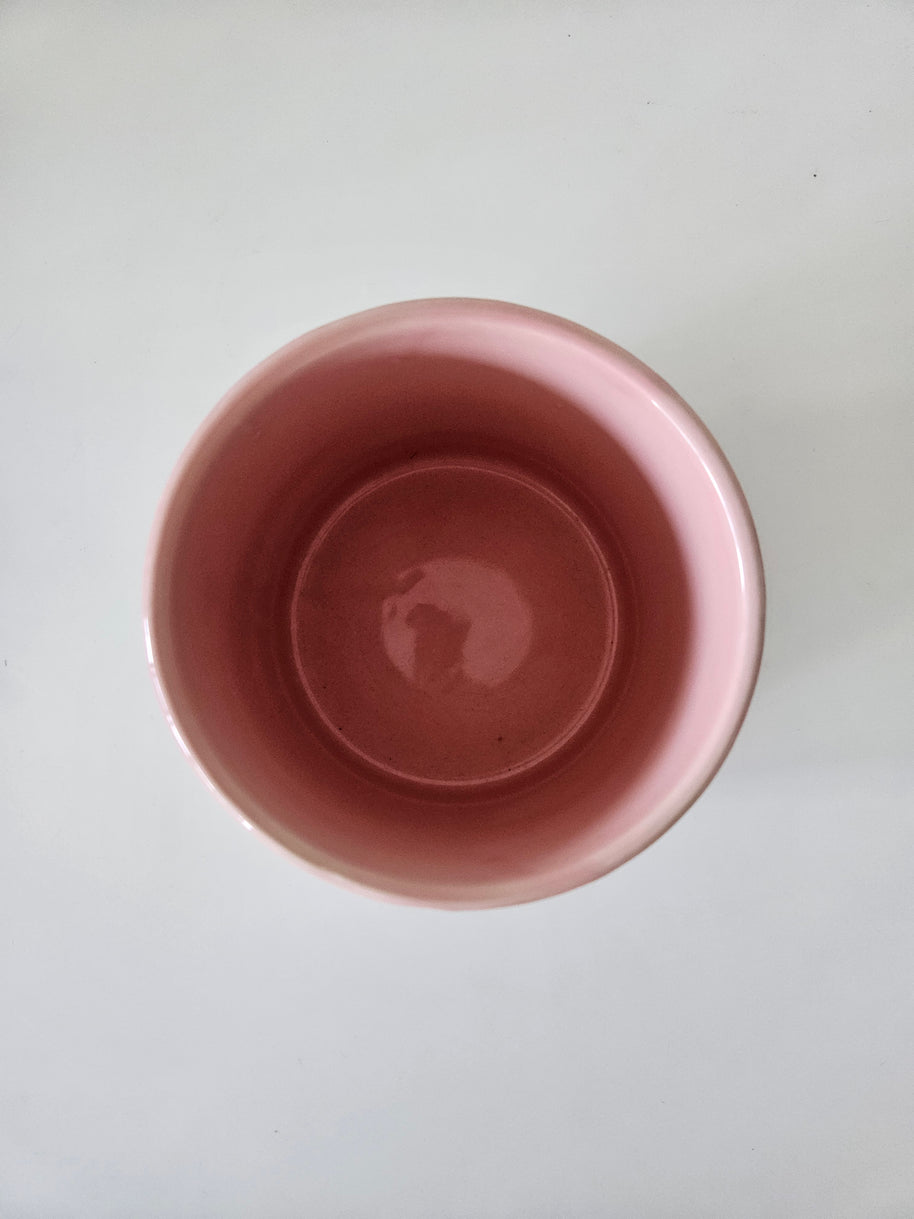 Top down view of a pink ceramic pot