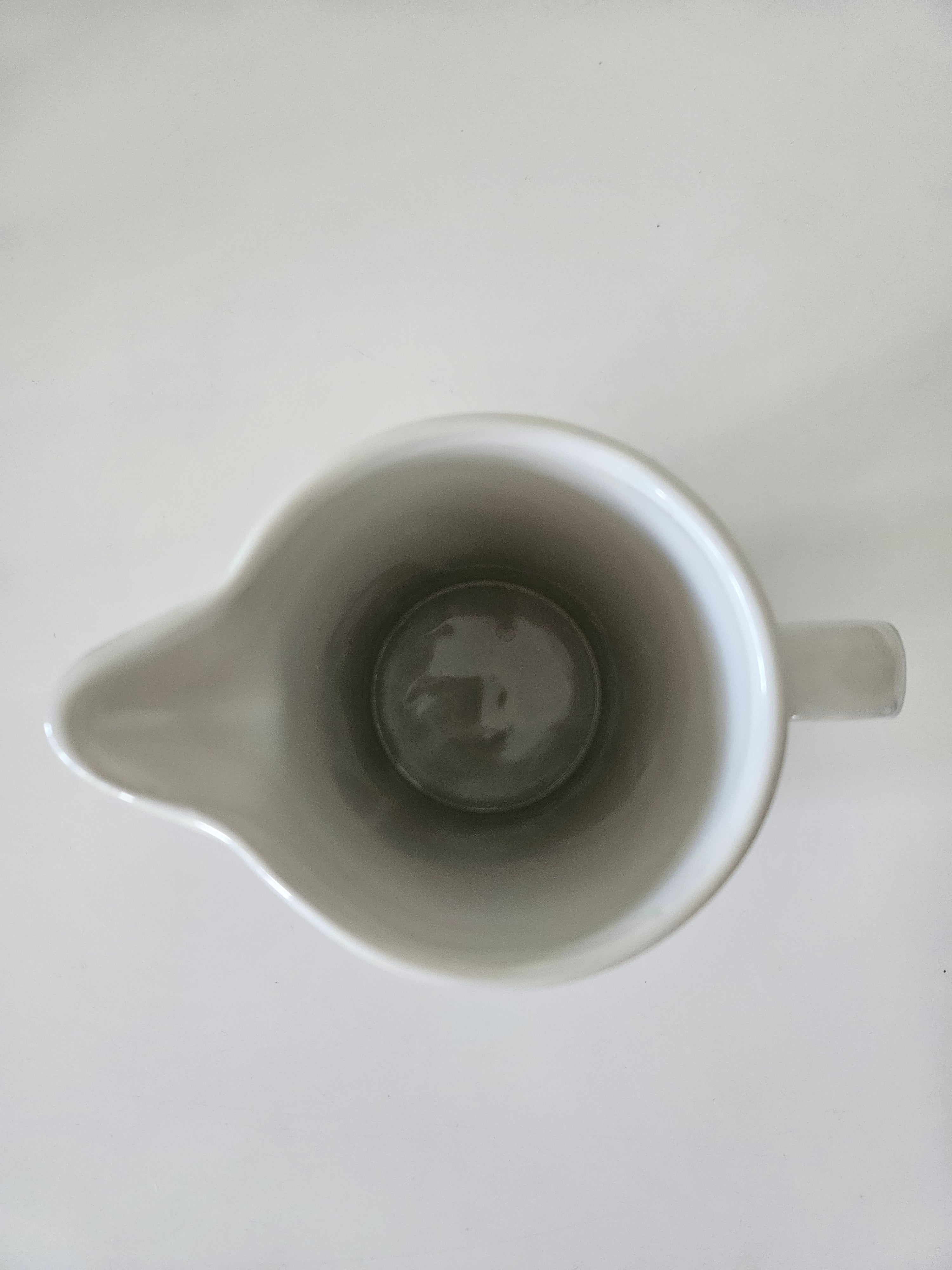 Top down view of a blue and white striped jug