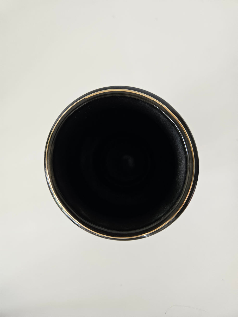 Top down view of a black ceramic vase