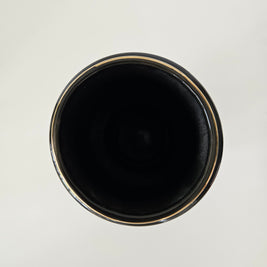 Top down view of a black ceramic vase